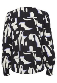 Blusa a righe bianco e nero con forme astratte, dotata di maniche lunghe, polsini elasticizzati e scollo tondo. Morbida texture del tessuto.