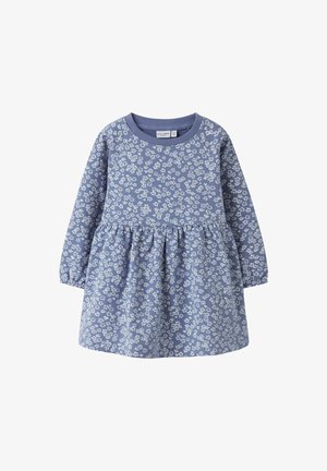 Blaues Baumwollkleid mit langen Ärmeln, einem gerafften Rock und einem weißen Blumenmuster. Verfügt über einen Rundhalsausschnitt und eine weiche Textur.