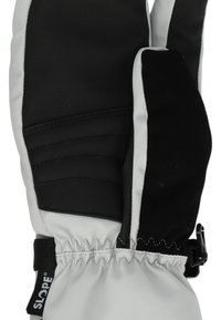 Musta ja harmaa hiihtohanska, jossa on teksturoitu pinta, joustava ranne ja säädettävä hihna turvallisen istuvuuden takaamiseksi. Vahvistettu kämmen ja sormenpäät.