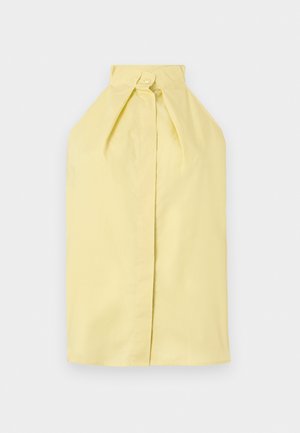 Αμάνικη κορυφή χρώματος παλ κιτρινο με λαιμόκοψη halter και κλείσιμο με κουμπί στο γιακά, με καθαρό, λείο μπροστινό πάνελ.