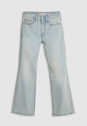 Light blue flared jeans made from denim. Features a mid-rise waist, two front pockets, and visible stitching along the seams.