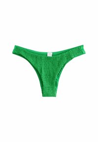 Vihreät bikinit vähäisellä kuviolla. Alhaalla oleva vyötärö ja ohuet sivuhihnat tarjoavat minimalistista peittävyyttä.