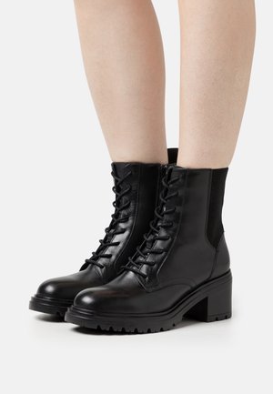 DAMIANA - Platform ankle boots - black