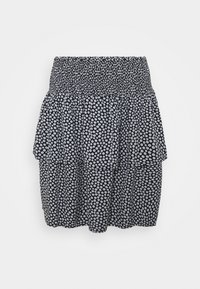 Černobílá sukně s puntíky a smockovaným pasem, s volánkovým, tiered designem a měkkou, lehkou tkaninou.