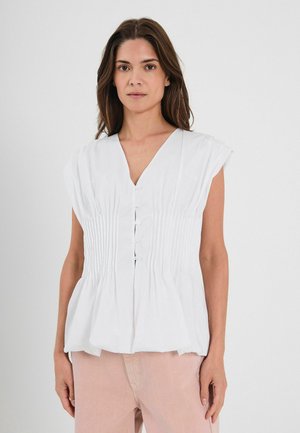 Blusa bianca senza maniche con scollatura a V, chiusura frontale con bottoni e tessuto arricciato in vita, creando un effetto peplum. Tessuto morbido.