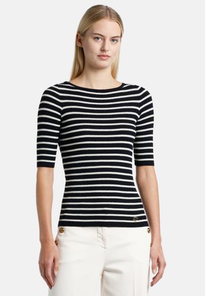 Black and white striped knitted top with a scooped neckline and short sleeves, featuring ribbed texture and a decorative logo accent at hem.