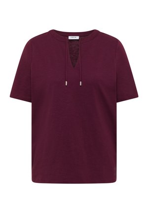 Chemise bordeaux à manches courtes avec encolure ronde, ouverture avant en V et liens coulissants, présentée sur fond blanc.