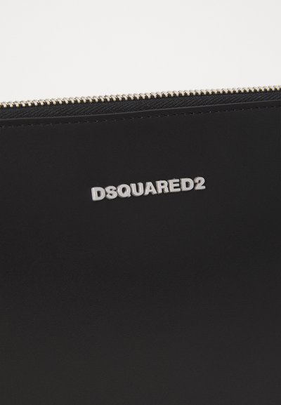 Black leather pouch with a smooth texture, featuring a silver-tone "DSQUARED2" logo and a metal zipper detail.