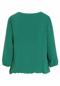 Blouse verte unie à manches trois-quarts et col rond, vue de dos sur fond blanc.