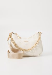 White leather handbag with embossed floral patterns, gold chain and strap accents, zip closure, and logo detail on the front.