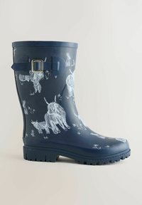 Tumesinised kummist vihmataldad valge loomakujulise mustriga, mis hõlmab kitsi ja jäneseid, külje pandlaga ja tekstureeritud tallaga.