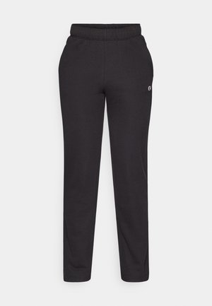 Must haveid pehmed, mis on valmistatud pehmest kangast, pa elastse vöökoha, sirgete jalgadega ja väikese logoga külgede peal.
