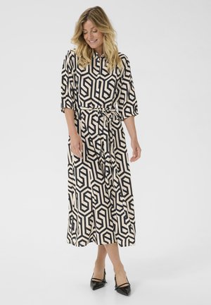 Langes bedrucktes Kleid in Creme und Marineblau, mit geometrischem Muster, Kragen, Dreiviertelärmeln und einem gebundenen Taillengürtel.