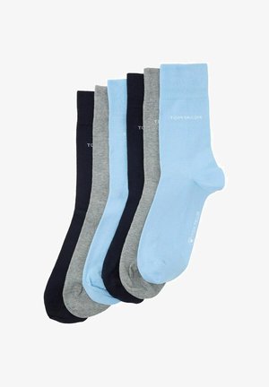 Ensemble de cinq paires de chaussettes de couleurs variées : bleu foncé, bleu clair, gris et marine. Fabriquées en tissu doux, avec des bords côtelés et des détails de logo.