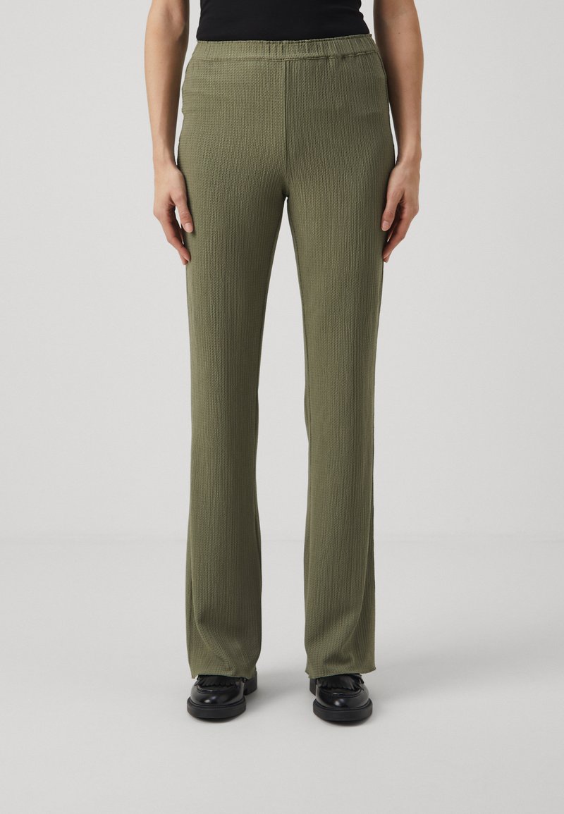 Olive green pants with a textured fabric, elastic waistband, and straight leg design. Flat front and subtle detailing enhance the look.