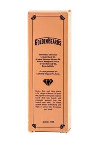 Golden Beards skärolja i en orange box med svart text och en diamantlogotyp. Innehåller ekologisk jojoba, argan- och sötmandelolja.