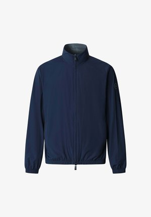 Navy blue lightweight jacket with full front zipper, stand-up collar, elastic cuffs and hem, and logo patch on left sleeve.