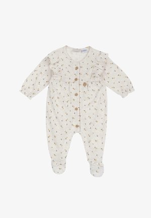 Une combinaison beige clair avec des manches longues, des volants, et un petit imprimé floral. Elle présente des boutons en bois et un design fermé pour plus de chaleur.