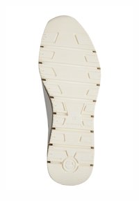 Schuhsohle aus strukturiertem weißem Gummi, mit tiefen Profilmustern und geformten Griffflächen, geschwungener Form und einem runden Logo an der Ferse.