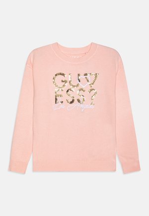 Maglione rosa chiaro con maniche lunghe, caratterizzato da un design con paillettes che include il testo "GUESS?" e "Los Angeles" in scrittura bianca.
