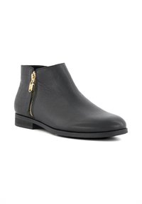 Black ankle boot with a textured leather surface, crocodile pattern accents, gold zipper detail, and a low block heel.