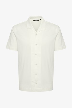 Rövid ujjú fehér ing, pamutkeverékből, puha tapintású, lapos gallérral, hat gomb a mellrészen, lekerekített alsó rész.