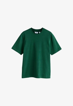 Tummanvihreä, lyhythihainen puuvillainen pyöreäkaulainen T-paita, keskikoko, yksivärinen malli, jossa näkyy merkkilappu kauluksen sisäpuolella.