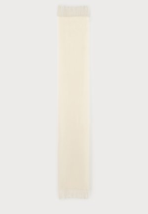 Longue écharpe rectangulaire de couleur crème avec des franges aux deux extrémités, présentée à plat sur un fond clair.