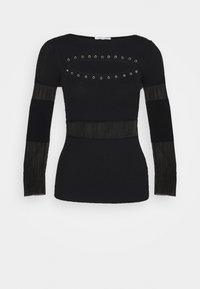 Haut en maille noir à manches longues et coupe ajustée, doté d'œillets en métal autour d'une découpe ovale sur la poitrine et de panneaux côtelés transparents sur les manches et la taille.