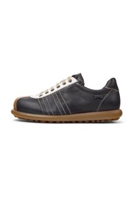 Black leather sneaker with white toe cap, brown rubber sole, and beige laces. Features three decorative stripes on the side and subtle stitching.