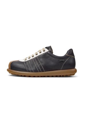 Black leather sneaker with white toe cap, brown rubber sole, and beige laces. Features three decorative stripes on the side and subtle stitching.