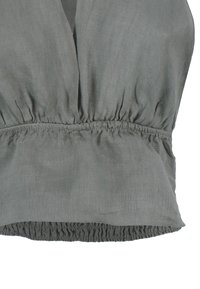Grijze linnen top met een gathered elastische tailleband en een losse pasvorm. Textuurstof met een subtiele glans, geschikt voor verschillende gelegenheden.