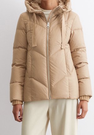 Beige puffer jacket with a zip front, hood, and drawstrings. Features quilted design, elastic cuffs, and a smooth, shiny texture.