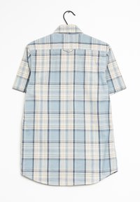 Camicia a maniche corte a quadri in blu, crema e blu navy. Presenta un colletto alla francese e un orlo curvo. Realizzata in tessuto leggero con una superficie liscia.