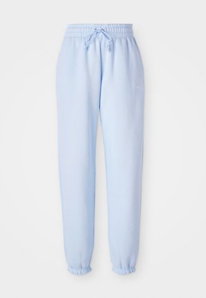 Pantaloni della tuta azzurro chiaro con vita elasticizzata e coulisse. Presentano un piccolo logo Nike di lato, arricciati alle caviglie.