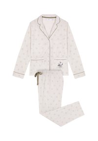 Pigiama in morbido tessuto color crema chiaro con un motivo testurizzato di piccoli fiori. Piping a contrasto, camicia con bottoni e pantaloni con vita elastica e cordino.