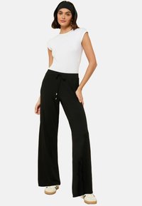 PETITE FIT  - Pantalones - black