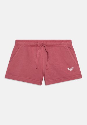 Rosa bomullsshorts med elastisk midjebånd, snor, to sidelommer og en hvit logo på venstre front.