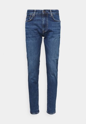 Herren Slim-Fit blaue Denim-Jeans mit Fronttaschen, Gürtelschlaufen und Knopfverschluss, gezeigt vor weißem Hintergrund.