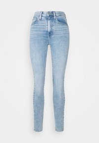 Vaaleansiniset skinny-farkut korkealla vyötäröllä, farkkukangasta, joissa on hienovarainen haalistunut kuvio ja klassinen viiden taskun muotoilu.