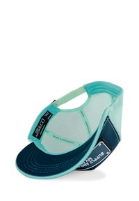 Mint green baseball cap with a navy blue visor, mesh backing, and a tag displaying "SUPPLY & CO" on the side. Textured pattern throughout.