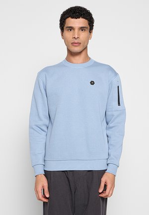 Lichtblauwe trui van een gestructureerde katoenmix, met een ronde hals, geribbelde manchetten en een ritszak op de linkermouw.