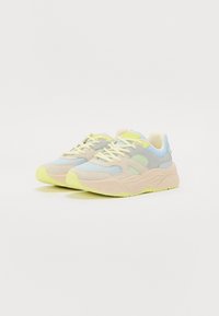 Lightweight sneakers with a mix of blue, gray, and beige materials; textured mesh and suede, with vibrant yellow accents on the sole and laces.