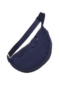 Marineblaue Schultertasche mit rundem Design, aus glattem Stoff gefertigt. Verfügt über einen Reißverschluss und zwei hängende Quasten. Verstellbarer Trageriemen inklusive.