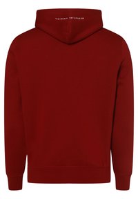 Felpa con cappuccio rossa in cotone con tasca a marsupio, polsini a costine e cappuccio. Il nome del marchio "TOMMY HILFIGER" è stampato in bianco sul retro.