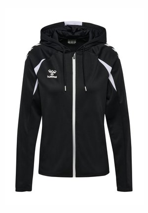 Veste noire zippée intégrale à capuche avec des accents blancs sur les épaules et les manches, logo hummel sur la poitrine gauche et cordons réglables à la capuche.