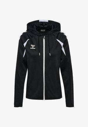 Veste noire zippée intégrale à capuche avec des accents blancs sur les épaules et les manches, logo hummel sur la poitrine gauche et cordons réglables à la capuche.