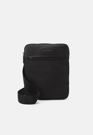 FLATPACK UNISEX - Across body bag - black