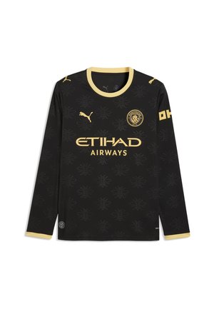 Zwart langärmelig Manchester City voetbalshirt met gouden bies, clubembleem, sponsorlogo, Puma-logo's en subtiel bijenpatroon.