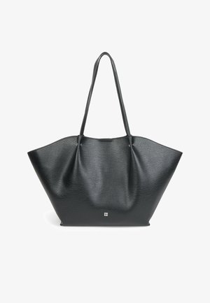 Black leather tote bag with a textured finish, wide shape, and two long handles; features a small logo at the base.